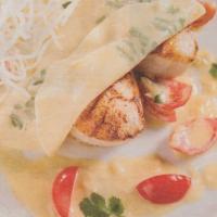Nage de coquilles Saint Jacques en ravioles